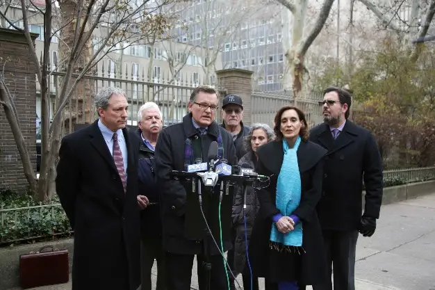 Attorney James Marsh and sexual assault victims and other attorneys hold a news conference in front of Rockefeller University Hospital in New York, Tuesday, Dec. 11, 2018.